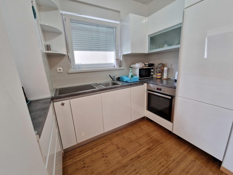 Kitchen with white fronts and oven