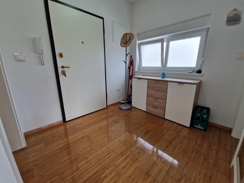 Hallway with entrance door and sideboard