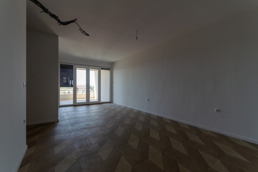 Bright room with herringbone floor in new building