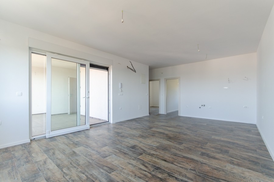 Open living area in the new building with sliding door to the loggia Croatia