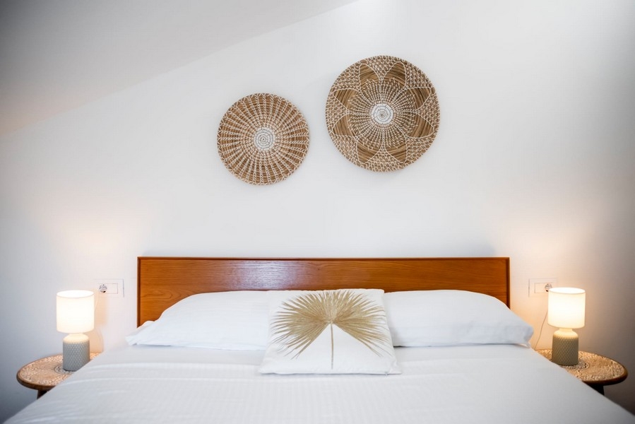 Double bed with wall decoration