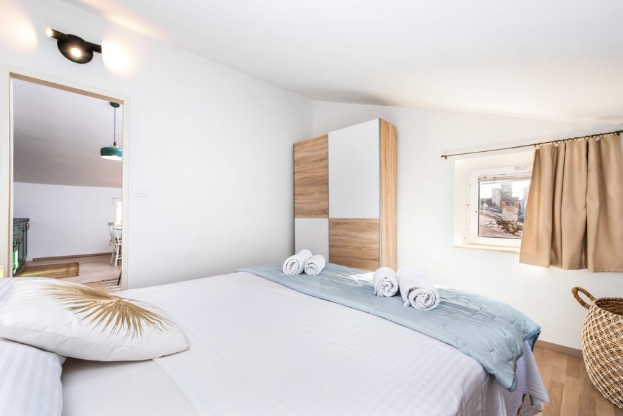 Bedroom with double bed and wardrobe