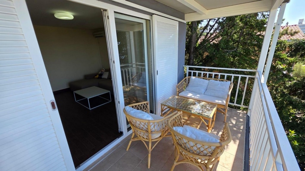 Covered balcony with seating area