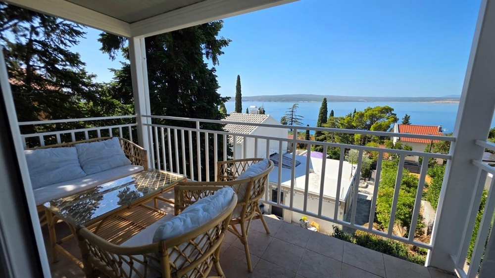 Balcony with wicker furniture and sea views