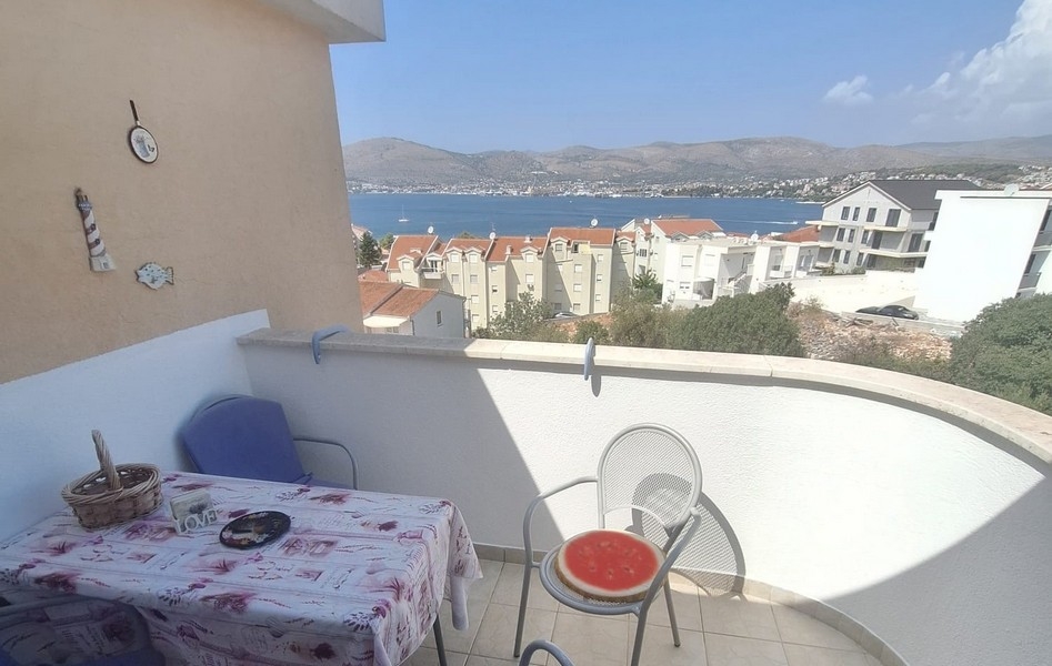 Balcony with seating area and sea views