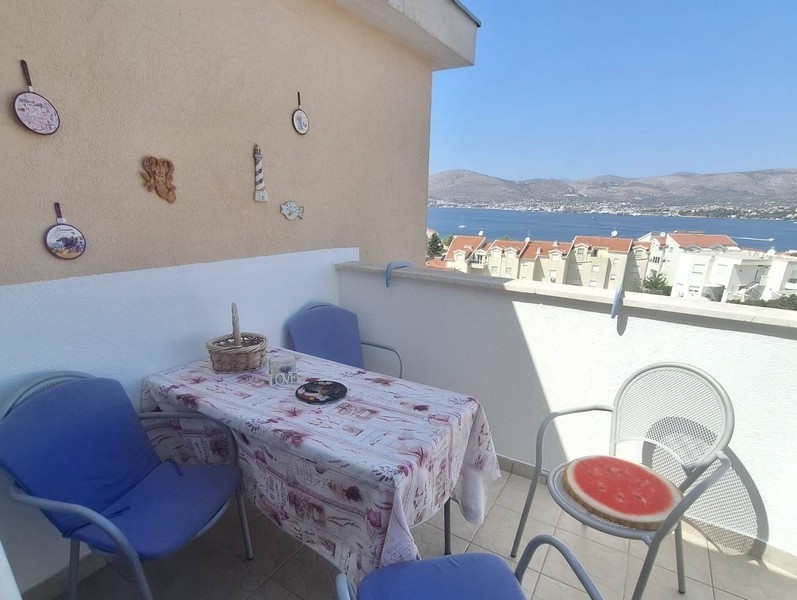 Seating area on the balcony overlooking the sea