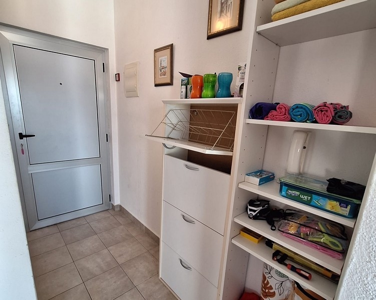Entrance area of ​​the apartment with shelves