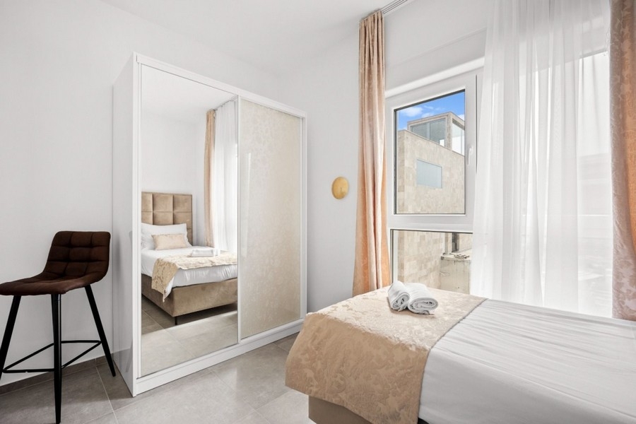 Bedroom with mirror cabinet