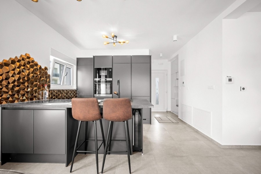 Kitchen with island and bar stools