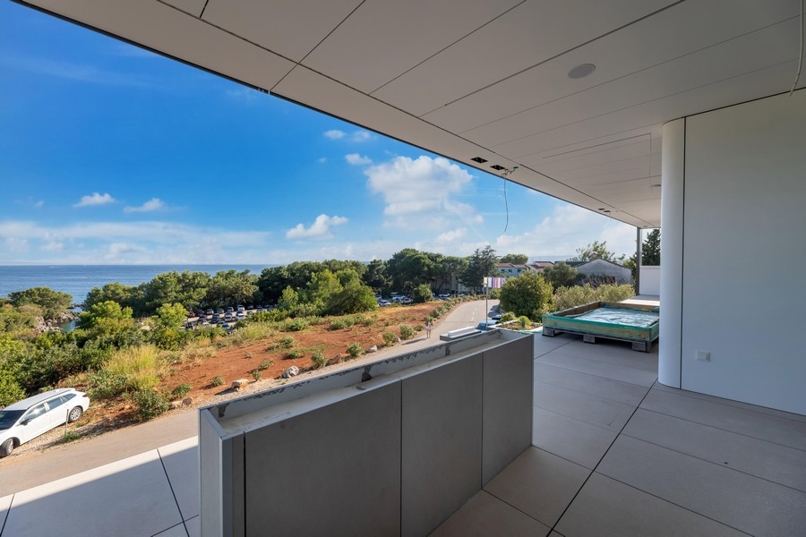 Covered balcony area with sea views in Krk