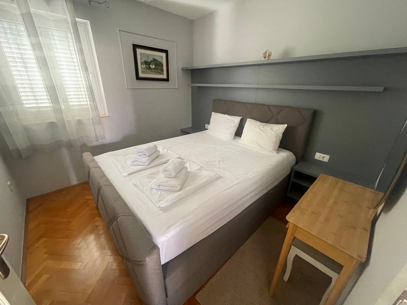 Bedroom with double bed and bedside table