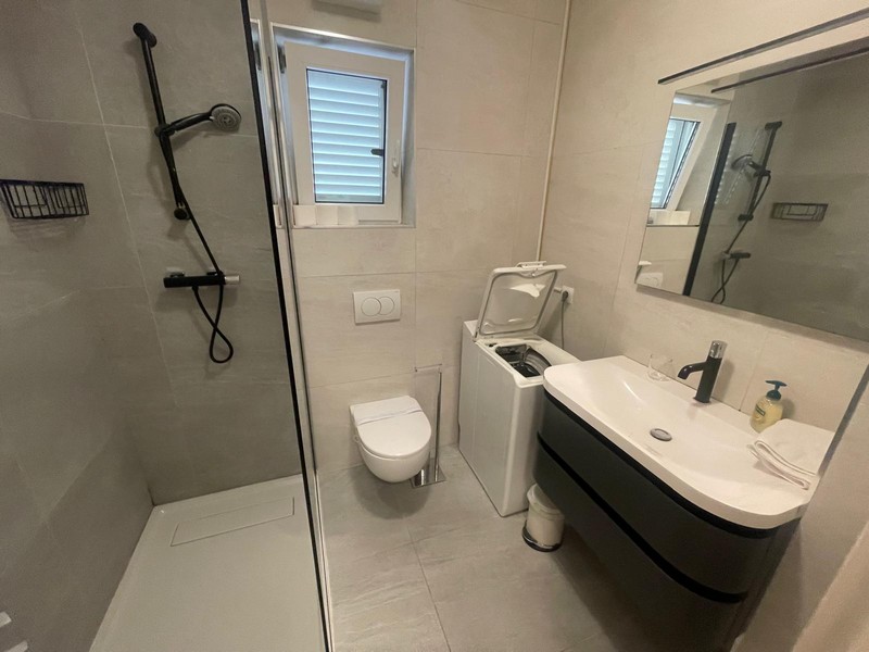 Bathroom with shower and vanity