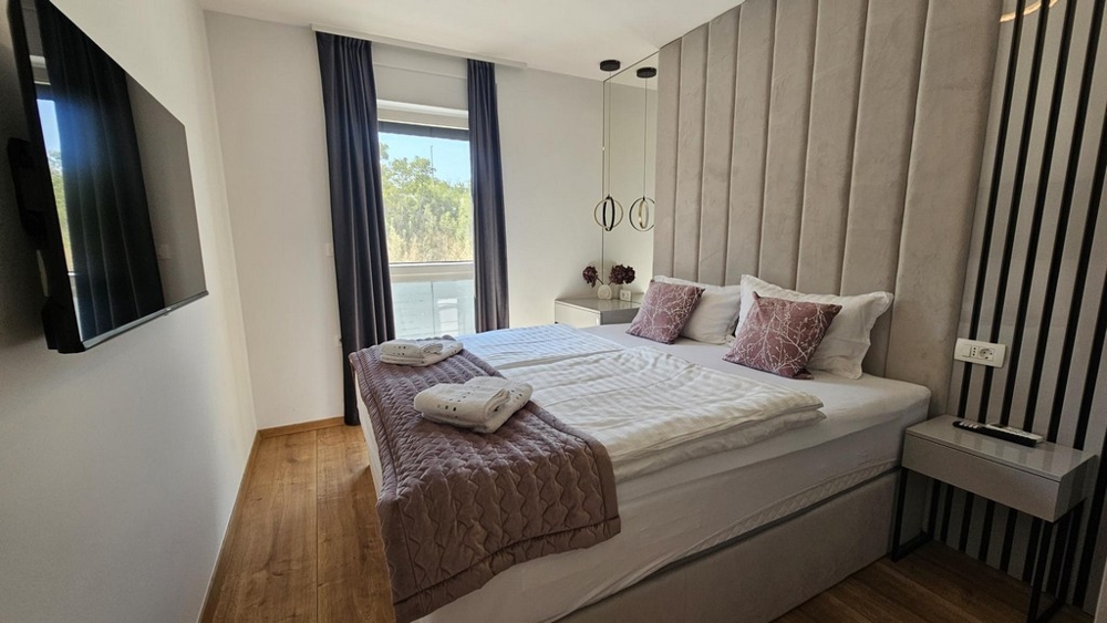 Bedroom with double bed in apartment on the island of Krk