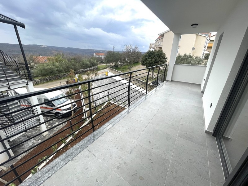 Covered terrace of the apartment with railings