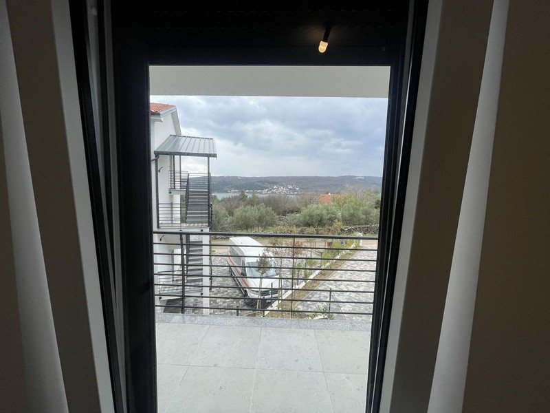 View through the patio door into the greenery