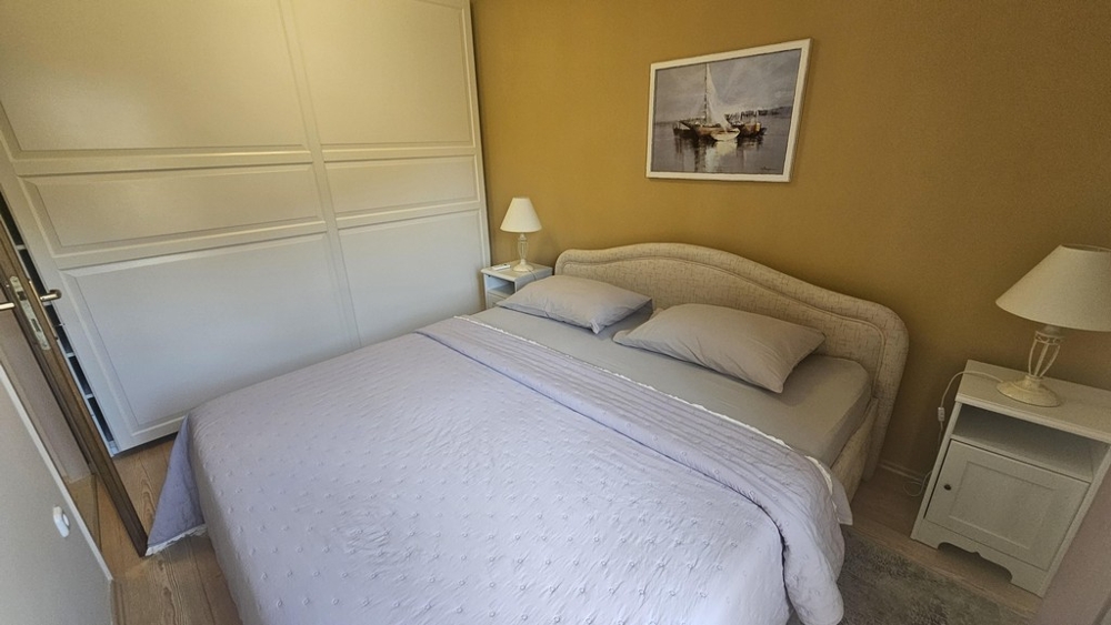 Bedroom with double bed and large wardrobe