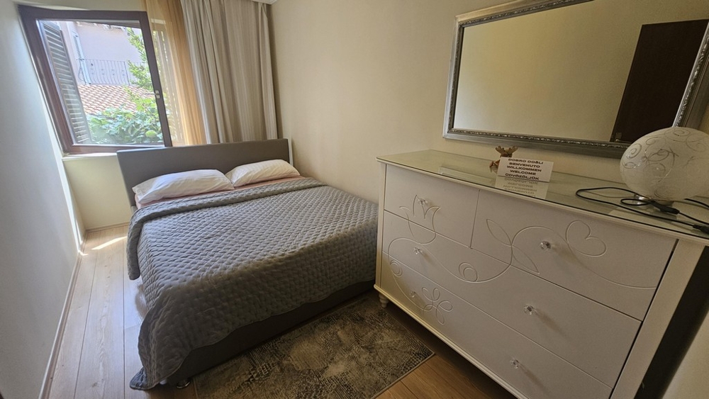 Second bedroom with double bed and chest of drawers