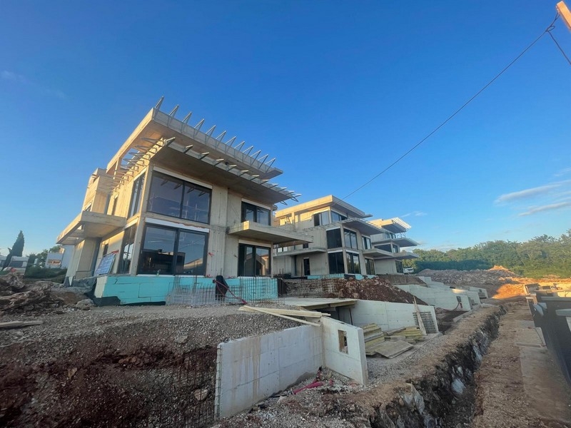 New building with penthouse in Njivice, view from the driveway