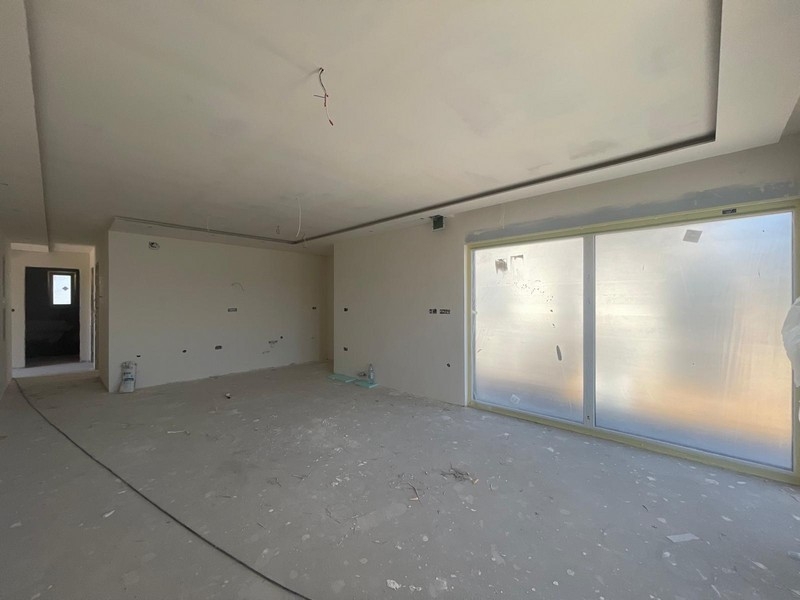Bright living room of the penthouse under construction
