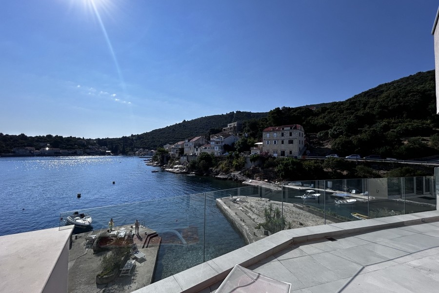 Terrace with glass railings and views over the bay of Racisce, Korcula