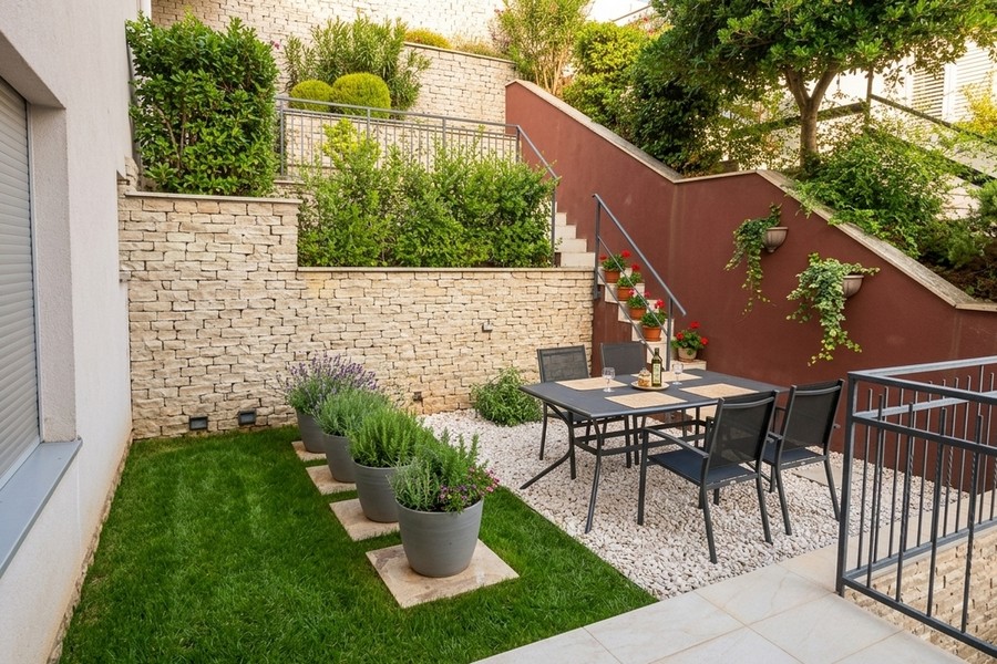 Garden area with lawn, natural stone wall and seating area, Korcula