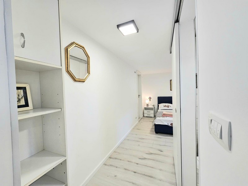 Hallway with built-in wardrobe and mirror in the apartment in Njivice