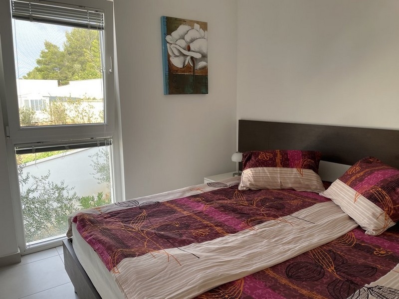 Bedroom of apartment with sea view in Murter, Croatia
