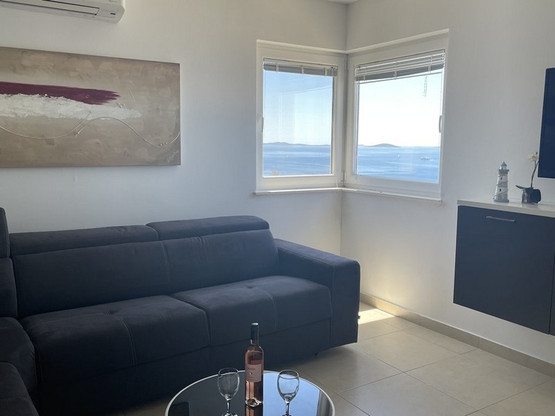Living room with air conditioning and sea view in apartment on Murter