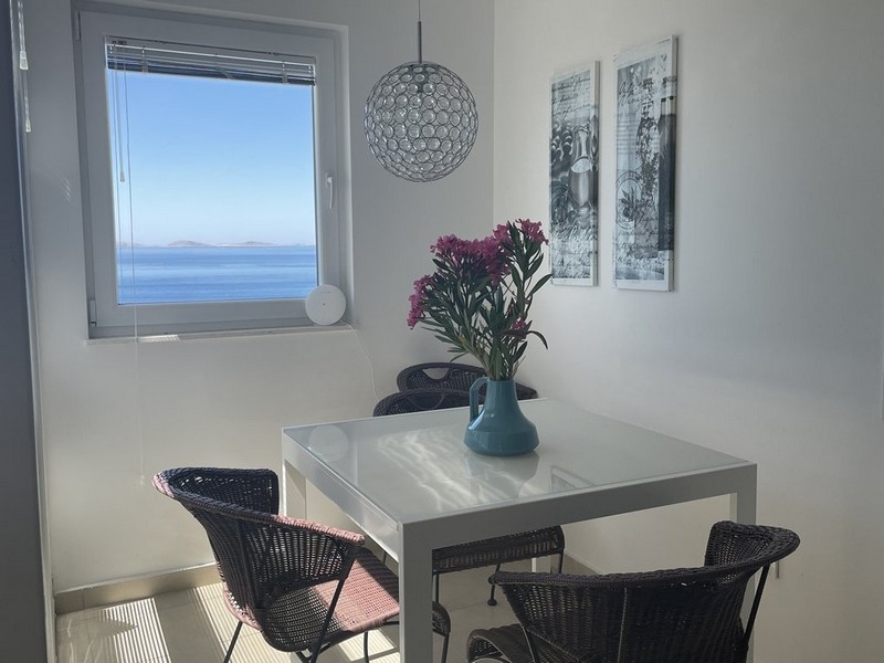 Dining area with sea views in furnished apartment on Murter