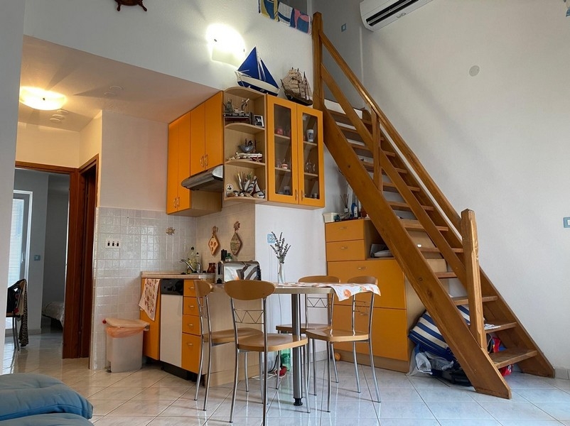 Living area with stairs to the gallery and seating area