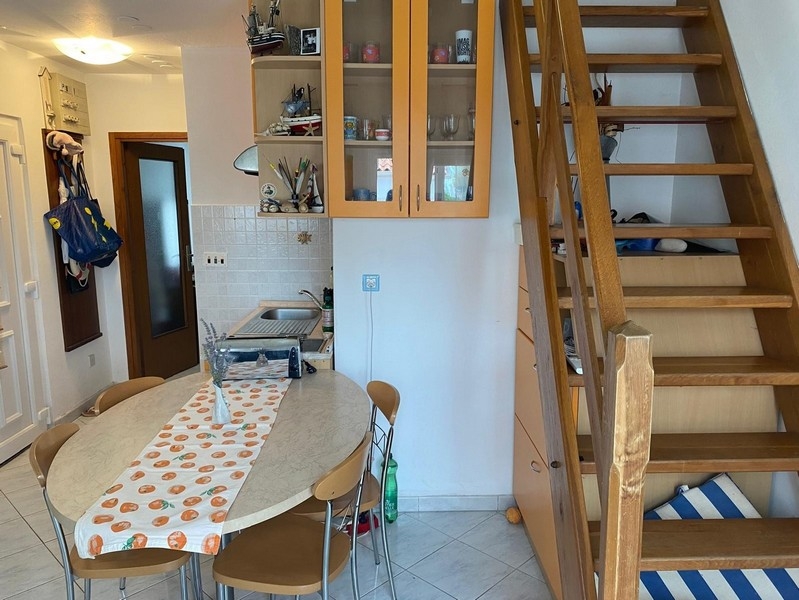 Wooden stairs to the gallery in the living area