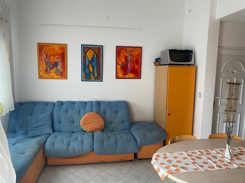 Living area with sofa and cupboard