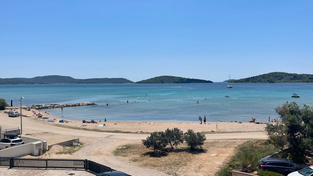 Pebble beach and sea views in front of the new building in Srima near Vodice