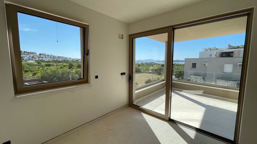 Living area with sliding glass door to the terrace and sea views