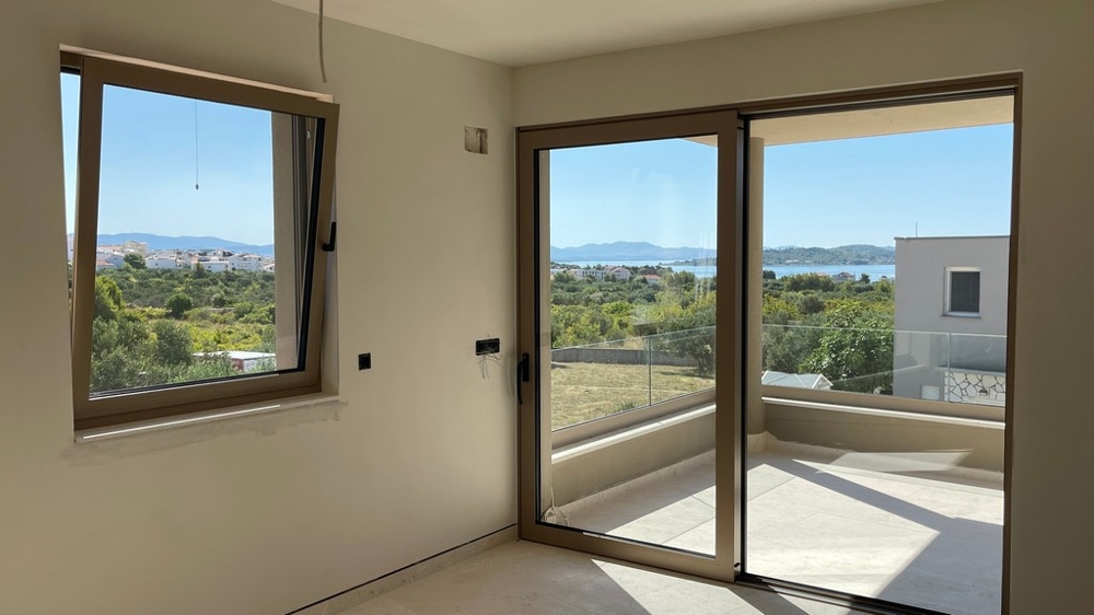 Living room with large window front and sea view in apartment A4106
