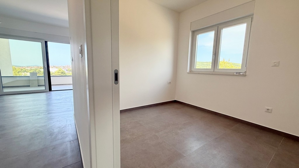 Bedroom with a view of the terrace in apartment A4107 in Vodice