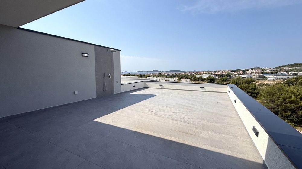 Wide roof terrace with a view over Vodice to the sea, apartment A4107