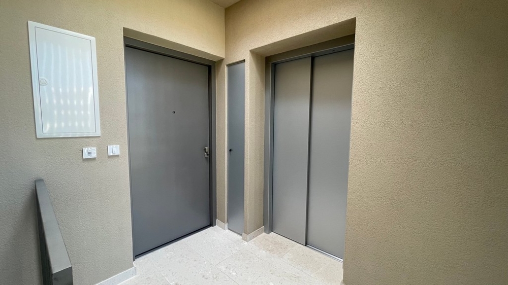 Entrance area with elevator in the new building in Vodice