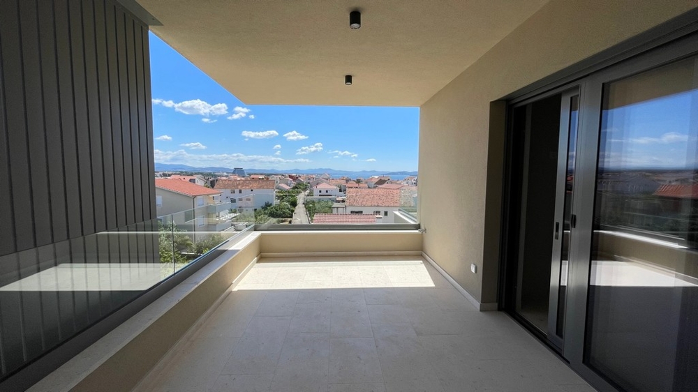 Covered terrace of the penthouse in Vodice with glass railings