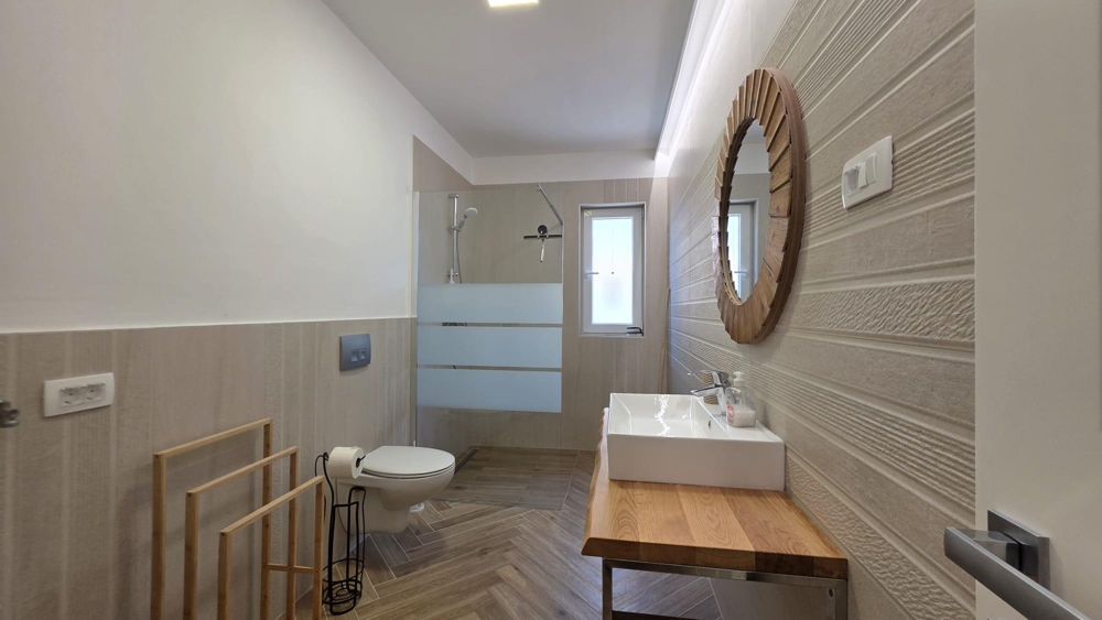 Bathroom with shower and vanity