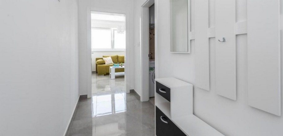Hallway with a view of the living area