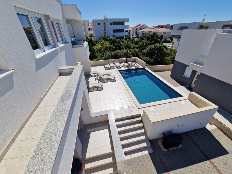 Heated community pool of the residential complex from above