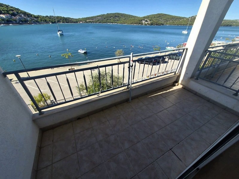 Loggia of the attic apartment with sea views in Tisno