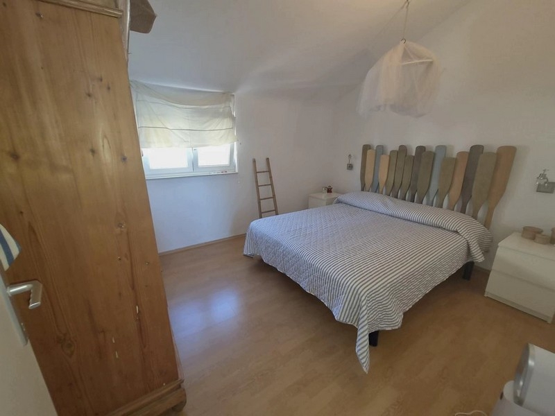 Bedroom of the attic apartment in Tisno