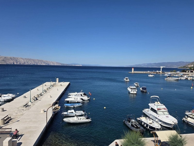 Senj harbor with boats and coastal views