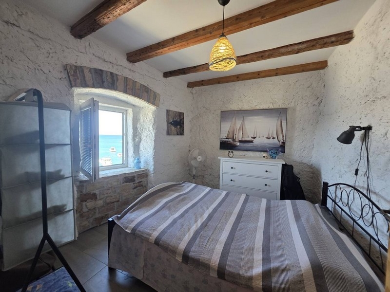 Bedroom with double bed and exposed beams