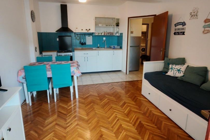 Kitchen and living area of ​​apartment A4115 in Novi Vinodolski