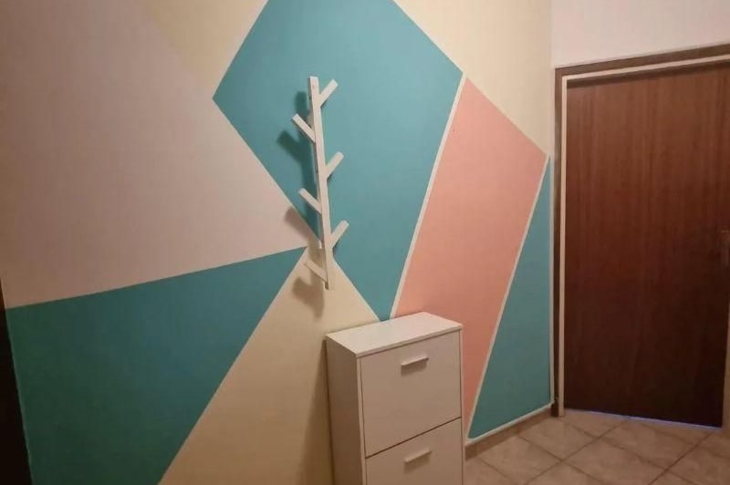 Hallway with wardrobe and entrance door of apartment A4115