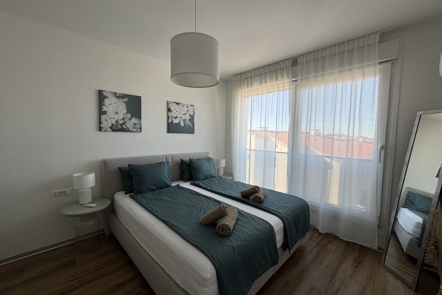 Bedroom with double bed in the penthouse in Trogir on Ciovo