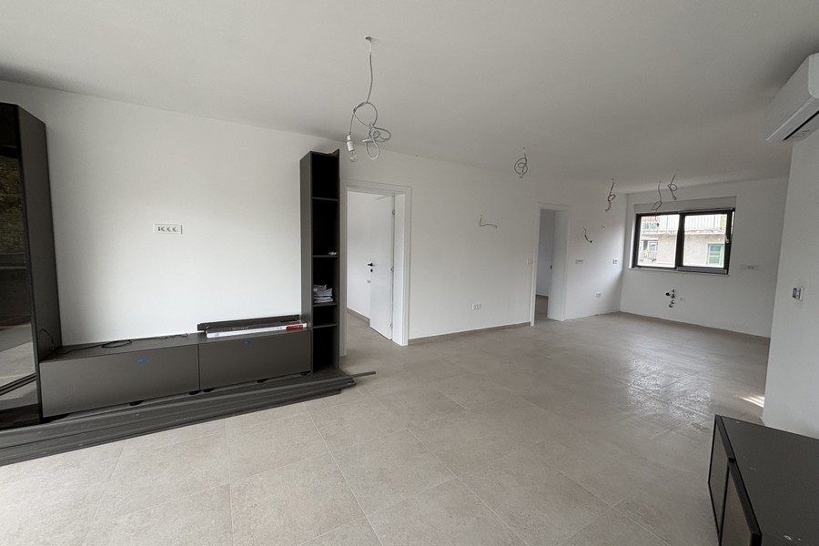 Open living area with kitchen and air conditioning